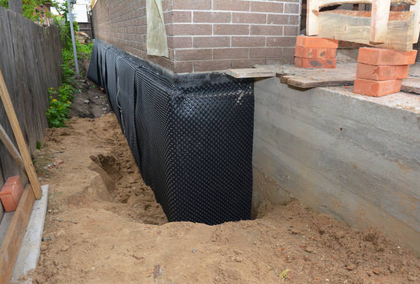 Happy homeowners after waterproofing job in Nunda